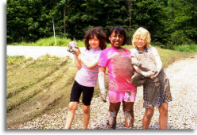 Girls playing in mud.